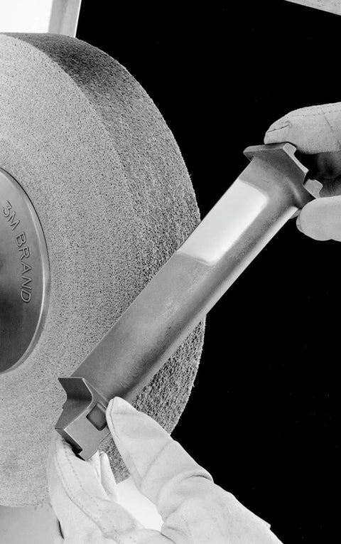 Worker using EXL PRO Deburring Wheel For Metal Finishing And Polishing, Unitized 6 In X 1 In X 1 In, on a metal piece