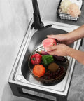 Wall Mounted Outdoor Kitchen Faucet with Filter Durable and Wear Resistant Professional Grade Perfect for Outdoor Cooking and Gardening Easy Installation in a stainless steel sink with fresh produce.