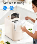 No Fuss Countertop Ice Maker Pumping Out 18 Lbs Of Crisp Bullet Ice Every 6 Minutes With A Slick Slim Footprint in cream white.