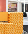 Stack of Bubble Mailers 8.5 By 12 Inches 200 Pack Self Sealing Padded Envelopes Durable Yellow Kraft Paper Mailers for shipping.