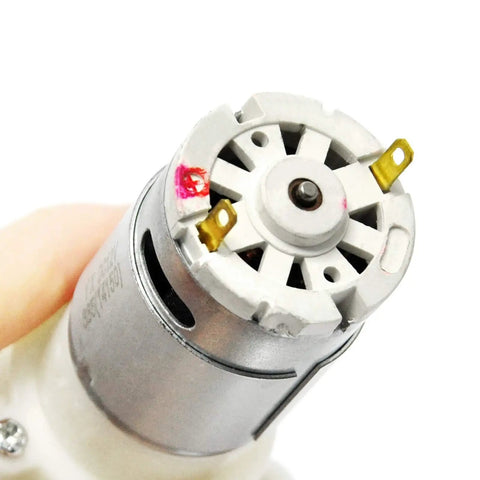 Close-up of Mini DC Water Pump 6V To 12V Diaphragm Pump with exposed motor and cooling case, ideal for DIY electronics.