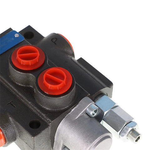 Hydraulic directional control valve with black body and two red BSPP port plugs; metal fittings.