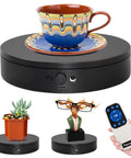 Foxvee Remote Control Electric Turntable Display Stand 360 Degree Silent Spinning Platform For Showcases with cup and figurines.