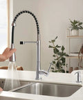 Precept Pull Down Kitchen Faucet With PowerInse Sprayer Chrome Finish 3 Function Spray in use over a modern kitchen sink