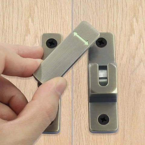 Hand installing Heavy Duty 90 And 180 Degree Flip Latch Lock for sliding barn doors, gates, sheds, antique bronze finish.