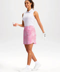 Woman wearing Womens 18 Inch Golf Skort With Zipper Pockets And Built In Shorts High Waist For Tennis And Pickleball Knee Length Curved Hem With Four Pockets For Secure Storage Pink Paisley XL, holding golf ball