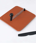 Anjali Fantastique Deluxe stainless steel vegetable cutter on orange base with serrated blade and two black posts.