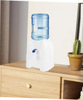 Cold Water Dispenser For Desk Portable Water Bottle Dispenser With Faucet For Home Office Camping And Outdoor Use Space Saving Tabletop Design Easy To Use Clean Durable BPA Free Materials on wooden desk with cactus