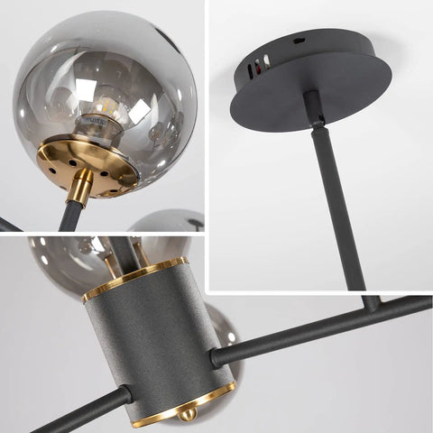 Close-up of Six Light Glass Globe Sputnik Chandelier In Matte Black With Amber Shade showing bulb holder and ceiling mount.