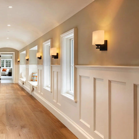 Modern Black Milk Glass Wall Sconces, 1 Pack Hardwired Wall Light Fixtures illuminating a hallway with warm light.