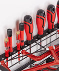 Close-up of tools organized on a Rugged 4 Layer Heavy Duty Power Tool Organizer Rack With Wall Mount Drill Holder, black steel structure.