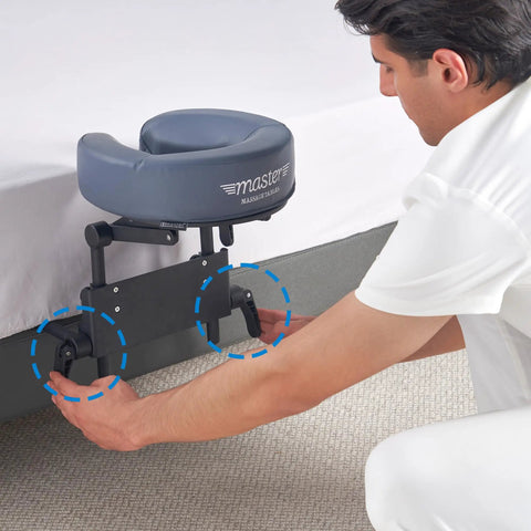 Home Mattress Top Massage Kit in Royal Blue with adjustable height being set up beside a mattress, includes headrest cushion.