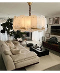 Slick Modern Marble Ceiling Pendant Light With Easy Dimmable Brightness And Genuine Stone Build That Totally Boosts Your Dining Room Or Kitchen Island Home Lighting Setup above a cozy beige sofa in a stylish living room.