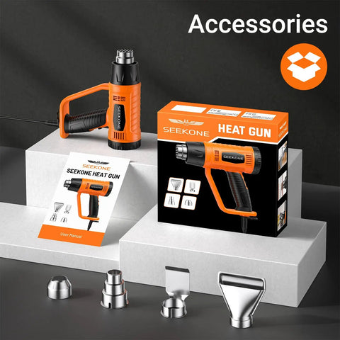 Powerful 1800W Heat Gun With Dual Temps 752F and 1112F, four nozzles, user manual, and box packaging displayed on a gray surface.