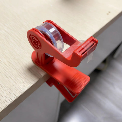 Versatile Adjustable Tape Dispenser With Precision Ribbon Cutter And Tough Locking Clip For Boss Mode desk organization on wood surface.