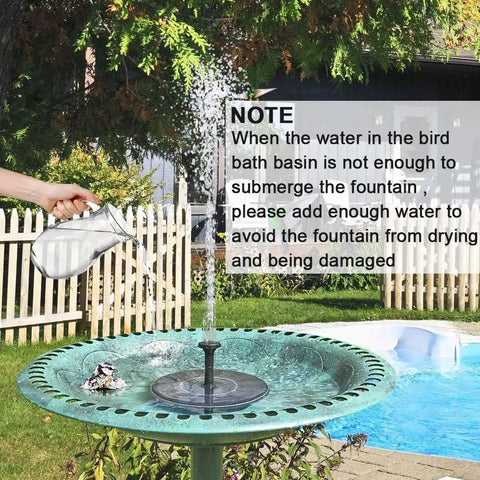 Sun Powered Bird Bath Fountain Pump 1.5W For Garden Patio Pond And Pool Floating Water Pump No Batteries Needed Easy Setup In Direct Sunlight Keeps Birds Happy With Gentle Spray shown in green bird bath with water pouring from jug in sunny garden setting.