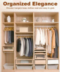 Heavy Duty Wooden Hangers 20 Pack With Non Slip Pant Bar For Closets in organized wardrobe with clothing displayed