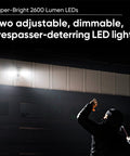 Intruder illuminated by Smart Floodlight Security Camera With 2600 Lumens, 1080P HD, Outdoor IP65 Weatherproof, Color Night Vision.