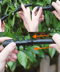 10 Pack Barbed Tee Irrigation Fittings For 1/3 Inch To 1/4 Inch Tubing, 6 Way Adapter shown in hands, outdoor garden setting