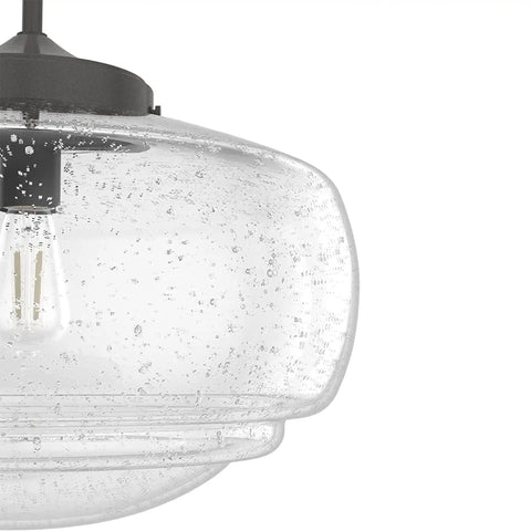 Close-up of Saddle Creek 1 Light Noble Bronze Pendant with Seeded Glass Shade showcasing schoolhouse ceiling fixture