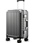 Carry-on luggage in angled front view; 20-inch, spinner wheels, charcoal metallic polycarbonate shell, aluminum frame