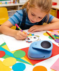 Child crafting with XL 3 Inch Circle Punch For Paper Crafts And Scrapbooking Easy To Use Spring Action Lever Cutter Blue.