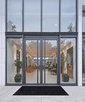 Workhorse Front Door Mat 5 by 3 Feet Indoor Outdoor With PVC Backing Striped Industrial Carpet at modern building entrance