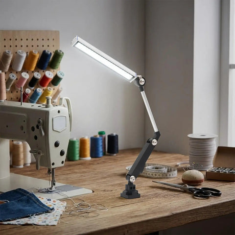 Heavy Duty 110V 16W LED Machine Work Light Featuring An Innovative 180 Degree Adjustable Bracket Designed For Superior Brightness And Flexibility Perfect For CNC Mills Lathes Drill Presses And Industrial Workshop Tasks With Stable Driver And Focus Beam illuminating a sewing workspace with adjustable arm.