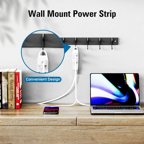 Three Outlet 25 Foot Extension Cord With Heavy Duty 16/3 SJTW 3-Wire Grounded Cable on a wall mount next to laptop and books.