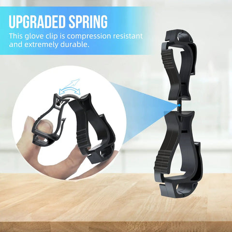 Close-up of black Durable Glove Clip Holder For Work Gloves Heavy Duty Clip with ergonomic design on a wooden surface