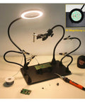 Magnetic Soldering Helping Hands With Flexible Arms And 360 Degree PCB Holder For Hot Air Gun Stand 5X LED Magnifying Light For Precise Soldering And PCB Inspection setup with black base, LED light illuminating a green PCB.
