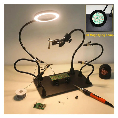 Magnetic Soldering Helping Hands With Flexible Arms And 360 Degree PCB Holder For Hot Air Gun Stand 5X LED Magnifying Light For Precise Soldering And PCB Inspection setup with black base, LED light illuminating a green PCB.