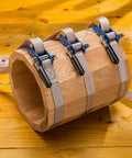Workhorse Durable 1 Inch By 15 Inch Quick Grip Band Clamp securing an oddly shaped wooden frame on a wooden surface