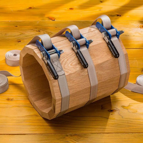 Workhorse Durable 1 Inch By 15 Inch Quick Grip Band Clamp securing an oddly shaped wooden frame on a wooden surface