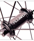 Close-up of carbon fiber hub on 700C Road Bike Wheelset With 30mm Aluminum Rim, Quick Release Front 100mm Rear 130mm, Black
