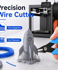 Top Shelf 3D Printer Tool Kit Featuring Slick Nozzle Cleaning Brushes And Heavy Duty Clog Poke Needles For Spotless Hotend Care. Precision wire cutter trimming supports on a 3D printed rocket.