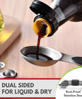 Close-up of Magnetic Stainless Steel Measuring Spoons Set 8 Pieces With Leveler, measuring liquid, dual-sided, rust-proof steel.