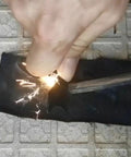 Using Emergency Fire Starter Kit With Char Cloth, Ultra Lightweight 12 Pack, Each 4x4 Inch Piece Cuttable, on a metal grate.