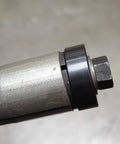 Astro exhaust pipe stretcher kit component, metallic tube with black collar and hex nut, close-up view