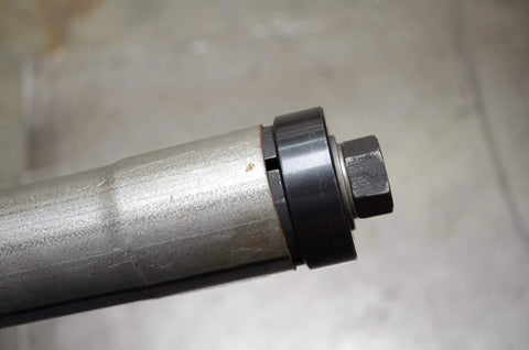 Astro exhaust pipe stretcher kit component, metallic tube with black collar and hex nut, close-up view