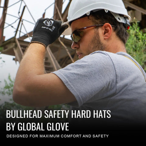 Worker wearing Bullhead safety hard hat and gloves, industrial background.
