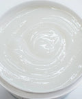 Open container of Heavy Duty Wallpaper Adhesive For Commercial Grade Hangs Heavy Wall Coverings Clear PRO 838 32 Ounce