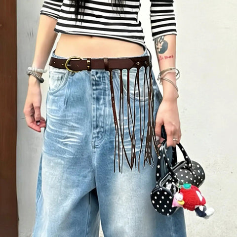 Vintage Industrial Waist Belt Featuring Heavy Copper Hardware And Flowing Tassels With Easy Adjustable Strap In Warm Coffee Brown For Daily Wear That Gives Serious Drip styled with high-waisted jeans.
