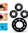 Turbine bearing set LXJZCP AXV055P for pool vacuum cleaners, 4-pack; black rings with silver bearings.