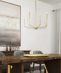 Gold Eight Arm Modern Chandelier With Two Height Options hanging over dining room table