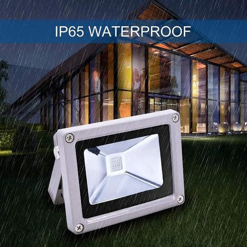 RGB Color Changing LED Flood Lights With Remote Dimmable IP65 Waterproof Stage Lighting For Indoor Outdoor Decor displayed outside in rain.