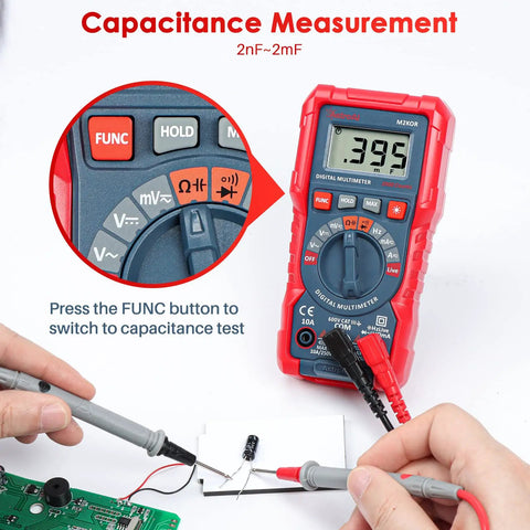 Handy Digital Multimeter M2K0R measuring capacitance on a circuit board with close-up on FUNC button and display