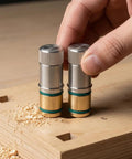 Hand using Self-Locking Table Stop Set For Workbench Holes, Non-Slip 20mm Crafting Bench Stop in wood