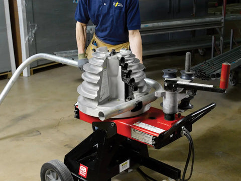 Gardner Bender B2000 Cyclone Electric Conduit Bender in use, bending aluminum pipe with malleable iron shoe, heavy duty power tool.