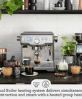 Dual Boiler Espresso Machine in Brushed Stainless Steel Featuring 58mm Commercial Portafilter and Precision Temp Control for Killer Shots and Legit Barista Quality Coffee at Home on kitchen counter.